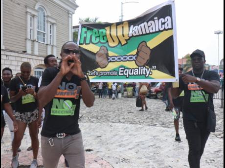 Some members of the entertainment fraternity in Montego Bay stage a peaceful protest on St James Street last Saturday.