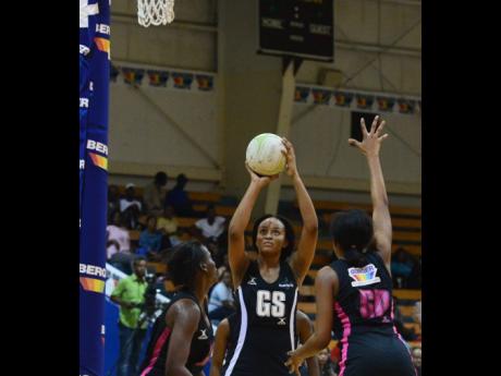 Gezelle Allison (left)  of Manchester Spurs shoots ahead of Abbeygail Linton of Kingston Hummingbirds during Game Two of the Berger Elite League finals in January 2019.