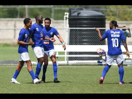 Mount Pleasant’s Francois Swaby (second left)  and teammates celebrate his goal against Humble Lion in the  Jamaica Premier League fixture held at the UWI/JFF Captain Horace Burrell Centre of Excellence last Saturday.