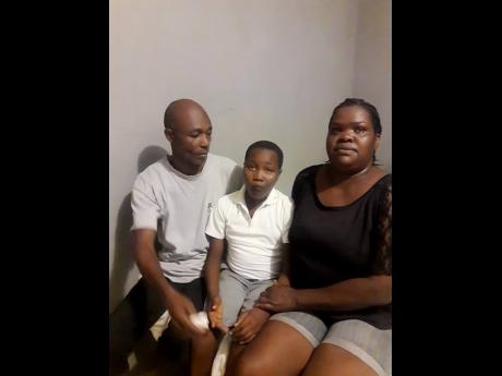 Credit: Contributed Gladstone Palmer (left) and spouse Sharon Allen with their son Ramel.