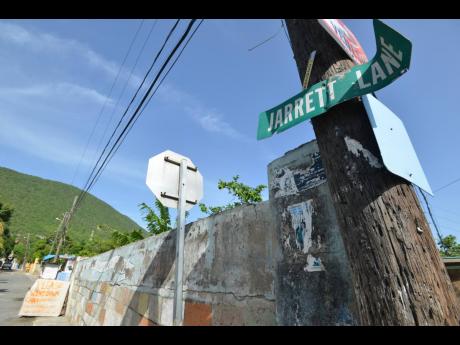 Jarrett Lane, off Mountain View Avenue, is tense after five persons were shot, two fatally, last Saturday in a drive-by incident.