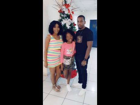 Credit: Contributed Shantoy (centre) with her parents Kimanie and Dave Ellis.