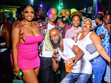 Bobby Phantom (third left), promoter of Whappingz Thursdayz, links up with patrons at last week’s anniversary party, held at Boomas Entertainment Complex, 13 Mall Road, St Andrew.