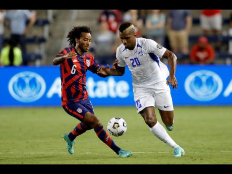 United States midfielder Gianluca Busio (left) battling Martinique’s midfielder Stephane Abaul during a Group B Gold Cup match on July 15.