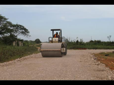 The farm road in St Jago, Toll Gate, Clarendon, being repaired.