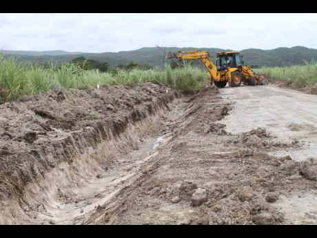 Drainage work being undertaken in St Jago, Toll Gate, Clarendon, where a mango agro-park is to be established.