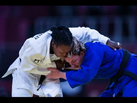 Jamaica’s Ebony Drysdale-Daley (left) competes against  Portugal’s Barbara Timo in the women’s 70kg elimination round of judo at the Tokyo 2020 Olympics at Nippon Budokan on Wednesday. Drysdale-Daley is Jamaica’s first Olympian for the discipline of judo. Daley lost by an Ippon (a warning worth 10 points). 
