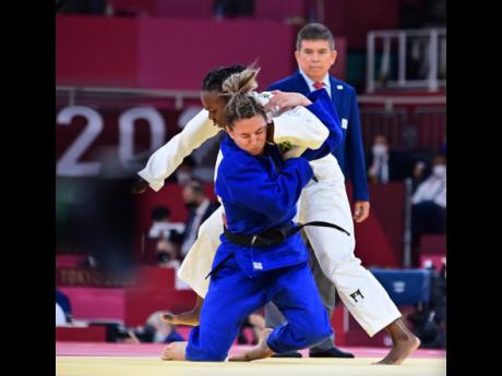 Jamaica’s Ebony Drysdale-Daley competes against Portugal’s Barbara Timo during the women’s 70kg elimination round of judo at the Tokyo 2020 Olympics at Nippon Budokan yesterday. Gladstone Taylor Photo