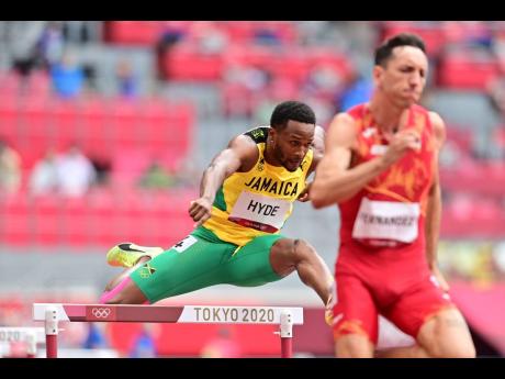 Jamaica’s Jaheel Hyde clears a hurdle during the men’s 400m hurdles heats at the Tokyo Olympic Games on Friday (last night Ja time). Hyde won his heat in 48.54 seconds.