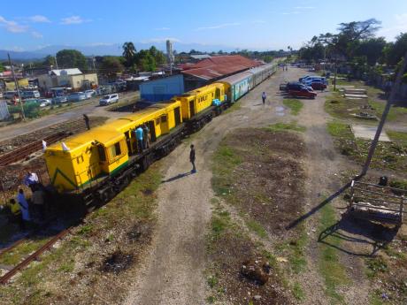 A Jamaica Railway Corporation train is seen at the Spanish town railway station.