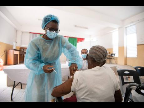 A senior citizen being vaccinated against COVID-19.