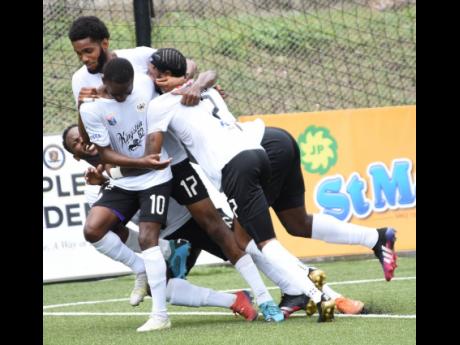 Ian Allen
Members of Cavalier’s Jamaica Premier League football team celebrate after scoring their third goal in a 3-1 win over Molynes United at the UWI/Captain Horace Burrell Centre of Excellence last Saturday.