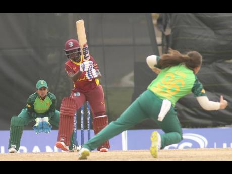 Rashada Williams (centre) of the West Indies Women's team in action against South Africa in the third One Day International at the Coolidge Ground in Antigua yesterday.