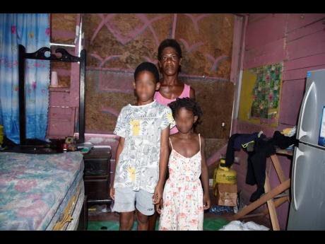 Jasmine Gillepsie and two of her children,  Kobe Dixon (left) and Kimona Grant. The children have not attended school since the pandemic. 