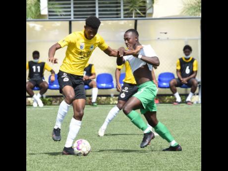 Ian Allen
Richard King (left) of Cavalier getting the better of  Vere United's Orane Ferguson during their Jamaica Premier League match last Saturday. Cavalier won 1-0.