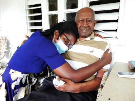 Alphonso Williams gets a hug from granddaughter Alejandra, who he says is his favourite. 