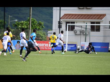 Harbour View Football Club’s Oshane Staple scores during their Jamaica Premier League quarter-final fixture against Harbour View at the UWI-JFF Captain Burrell Centre for Excellence yesterday. The game ended 1-1. Mount Pleasant secured a semi-final spot with a 4-2 aggregate win, after taking Saturday’s first-leg 3-1.  