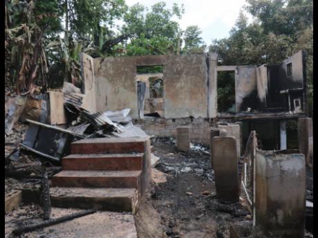 These houses were set ablaze in Granville, St. James, by hoodlums.
