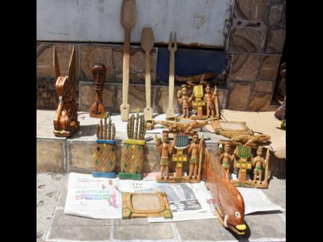 Benneth relies on the sale of his wood carvings to care for himself and his 16-year-old son.
