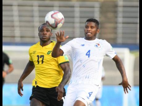 Jamaica’s Michail Antonio (left) challenges Panama’s Fidel Escobar for the ball during their Concacaf  World Cup Qualifying match at the National Stadium on Sunday, September 5.