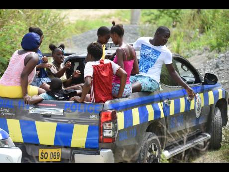 Residents from St Thomas communities including Bath and Spring Bank join police in search of Winshae.
