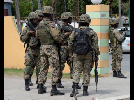 Credit: File Members of the Jamaica Defence Force soldiers in Bull Bay, St Andrew.