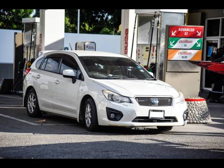 The car in which two men were killed at a Red Hills Road gas station last Monday.