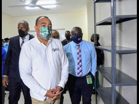 Minister of Health and Wellness, Dr Christopher Tufton leads a tour of the $47.3-million upgraded Flanker Health Centre in St James, which was officially reopened on Wednesday.