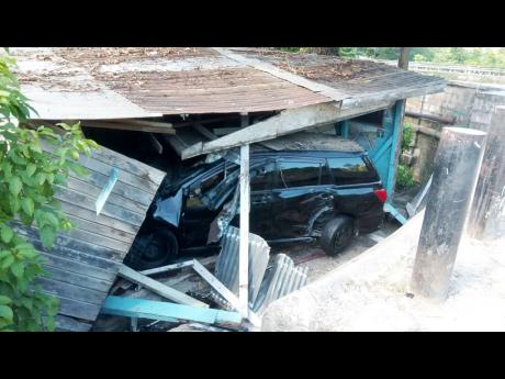 Credit: Hopeton Bucknor This car crashed into the shop run by Collins and Clarke, which is at the front of their house.