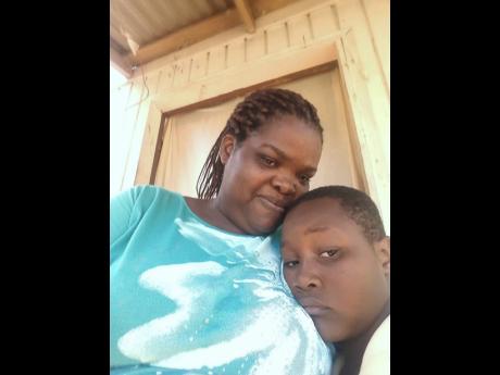 Ramel Palmer rests on his mom Sharon Allen.