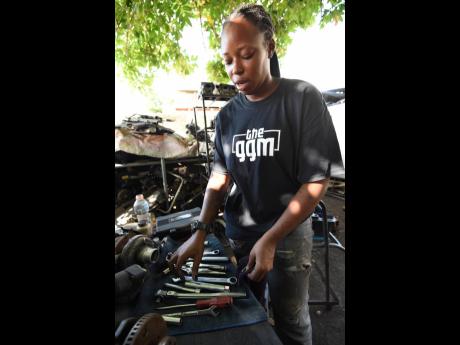 Stephens cleans her tools after completing a job.