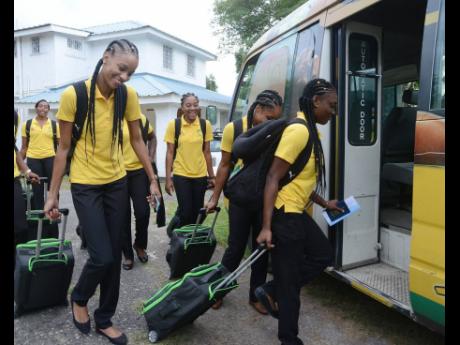 In this file photo from November 2016, Jamaica’s Sunshine Girls board the team bus, which transported them to the airport for their flight to England for a test series. The bus pictured was stolen from the team’s base in St Andrew on Sunday, August 15.
