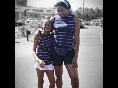 Credit: File Sunshine Girls goal shooter Jhaniele Fowler (right) and her daughter Drehannah.