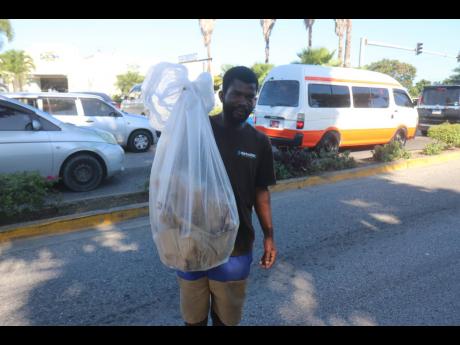 Dane Brown pauses from his trash collecting initiative.