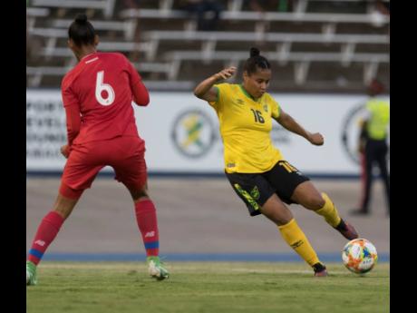 Reggae Girl Dominique Bond-Flasza (right) in action against Aldrith Quintero of Panama during a  friendly international at the  National Stadium on Sunday, May 19, 2019. 