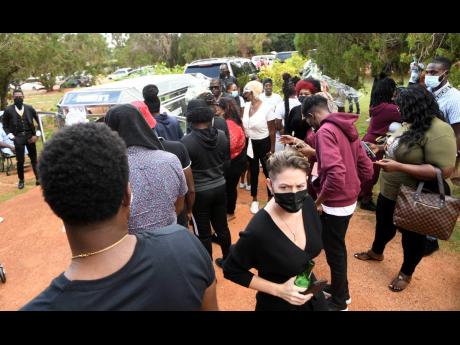 Leah Tavares-Finson, (foreground) at the funeral of Christopher ‘Dog Paw’ Linton at Dovecot Memorial Gardens in St Catherine last Friday.