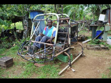 In this 2007 photo, Noel Malcom shows off his partially self-constructed helicopter at his home in Duanvale, Trelawny.