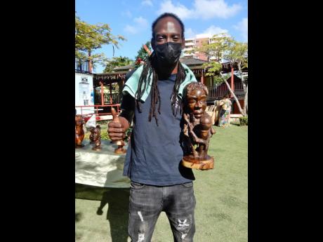 Marlon Frenceco  shows off one of his favourite pieces, ‘Peter Tosh Chanting on the Mic’. 