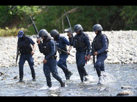 Policemen on the hunt for Davian Bryan in October.