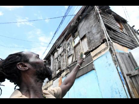 A two-storey board house in Denham Town, Kingston. The census will look at areas such the housing stock to see how Jamaicans are living.