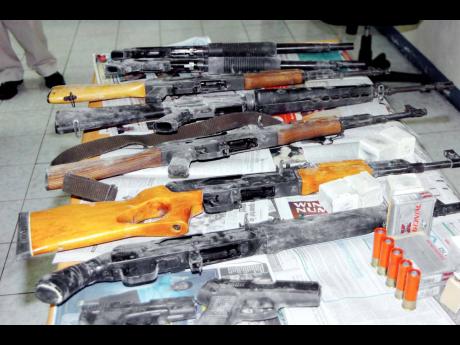 A stash of illegal firearms, magazines and ammunition that were intercepted by the police.