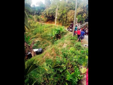 Credit: Rasbert Turner The Nissan X-trail sports utility vehicle which careened off the road in Harkers Hall, St Catherine on Thursday.