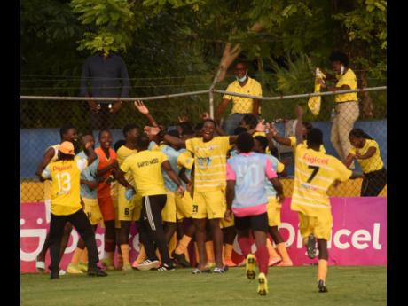 Garvey Maceo players celebrate after advancing to the ISSA daCosta Cup final by defeating defending champions Clarendon College at the STETHS Sports Complex in Santa Cruz, St Elizabeth, yesterday.