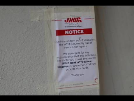 The sign outside an ATM located on Harbour Street in Kingston, indicates to persons that the manchine is not in use after it was set it on fire on January 5.
