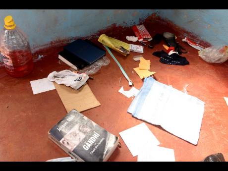 Various books and sheets of handwritten paper are among the variety of items that remain in the house.