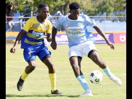 Action between Edwin Allen High School and St Elizabeth Technical High School in the ISSA Ben Francis Cup final at the STETHS Complex in Santa Cruz, St Elizabeth on Friday.