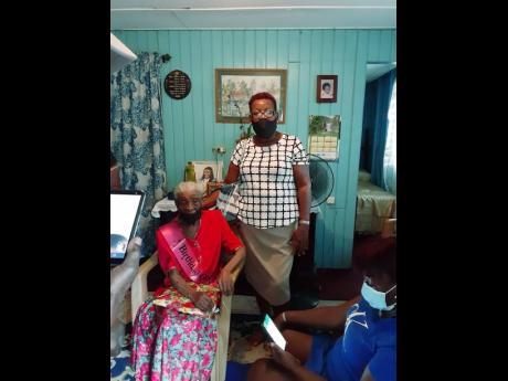 Vilma Henry, a member of the Mello Agers club, Portland chapter, shares a moment with Miss Elsie.