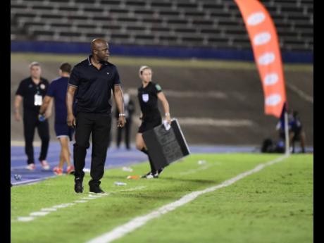 Reggae Boyz head coach, Paul Hall (centre), looks on during the Jamaica vs Costa Rica Concacaf World Cup qualifying football match at the National Stadium in Kingston last night. Jamaica lost 0-1.