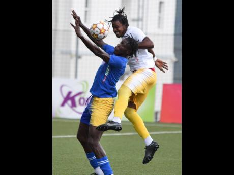 Credit: Ian Allen Trivante Stewart (left) from Molynes United and Kevin Graham (right) from Vere United are involved in an aerial battle for the ball during the Jamaica Premier League football match at the UWI-JFF Captain Horace Burrell Centrer of Excellence last Tuesday.