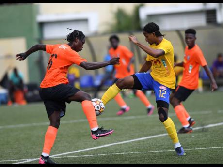 Credit: Ricardo Makyn Tivoli’s Horation Morgan (left) vies for the ball with Harbour View’s Casseam Priestley during the Jamaica Premier League football encounter at the UWI-JFF Captain Horace Burrell Centre of Excellence on Tuesday. Harbour View won 2-1 and their coach, Ludlow Bernard, is hoping his youthful brigade will continue their successful drive when they tackle Arnett Gardens in JPL action tomorrow. Story on page 20.